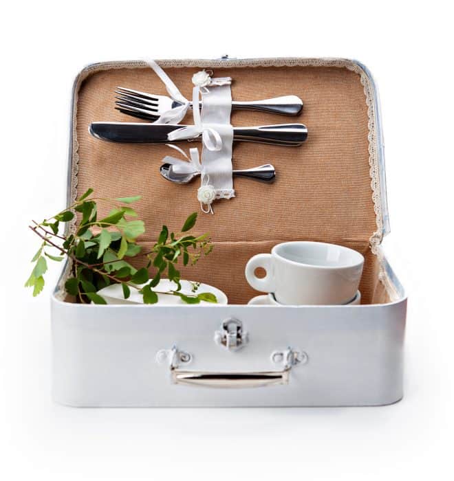 white handmade box for a picnic with tableware on white background
